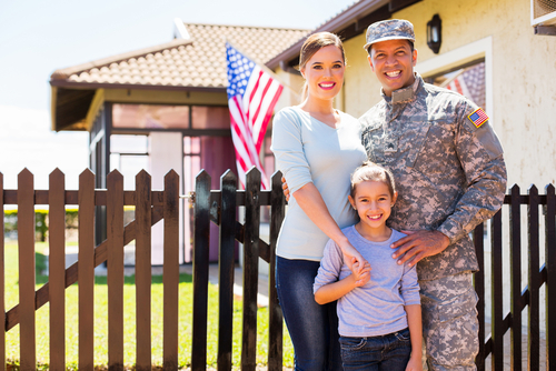 Military family posing and smiling